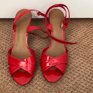 Tory Burch red patent heels with gold heel.
